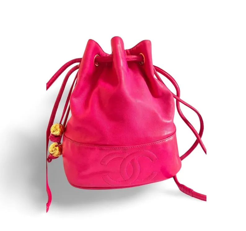 CHANEL Vintage fusia pink lambskin hobo bucket shoulder bag with CC golden balls and CC stitch mark